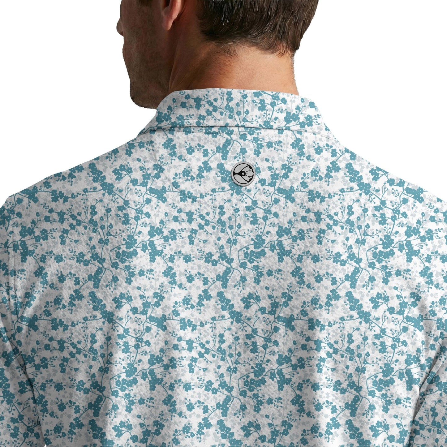 Floral patterned shirt worn by a person on a white background