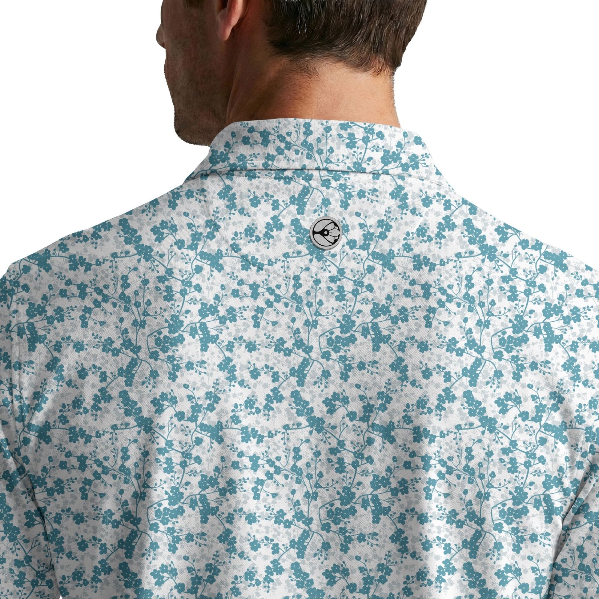 Floral patterned shirt worn by a person on a white background